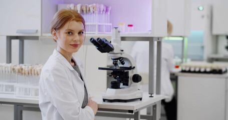 Pharmacy scientist working with professional microscope in technology lab.