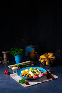 Asparagus with black forest ham, carrots and hollandaise sauce.