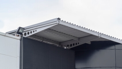 Modern metal outdoor canopy on building