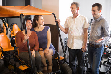 family of tourists of different generations hire bike carriage