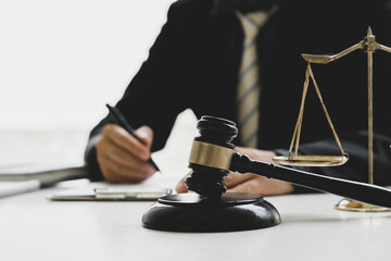 Judge gavel with Justice lawyers, Business woam in suit or lawyer working on a documents. Legal law, advice and justice concept.