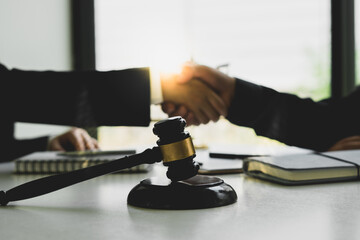 Businessman shaking hands to seal a deal Judges male lawyers Consultation legal services Consulting in regard to the various contracts to plan the case in court