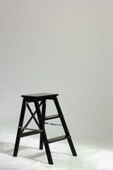 Black studio chair on a white background.