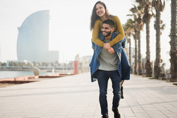 Happy couple having fun outdoor in barcelona city - Soft focus on man face