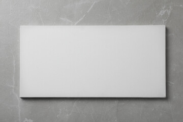 Blank canvas on grey stone background, space for text