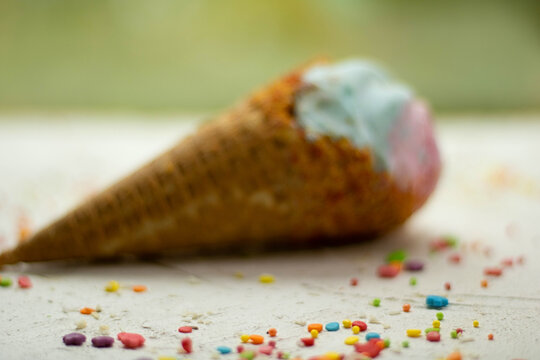 multicolored ice cream cone on a white table