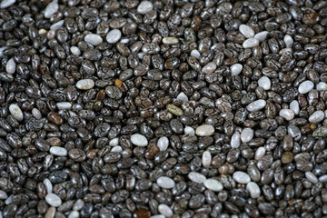 Chia seeds photographed in the studio in detail against black background