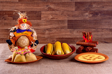 Brazilian june party. Typical foods of the June festival. hominy, boiled corn, corn cake, popcorn, broccoli, paçoca, genipapo and peanuts. It is written: Viva Sao Joao in Portuguese