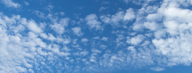 banner with blue sky with white clouds. Spindrift clouds.