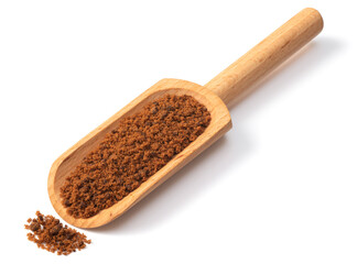 brown granulated sugar in the wooden scoop, isolated on pure white background