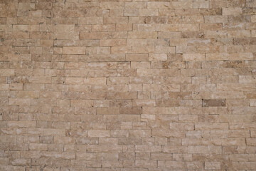 Cream yellow bricks on wall decoration for background.
