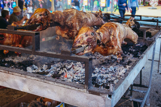 Food tent serves roasted lamb during the Trumpet Festival in Guca village, Serbia