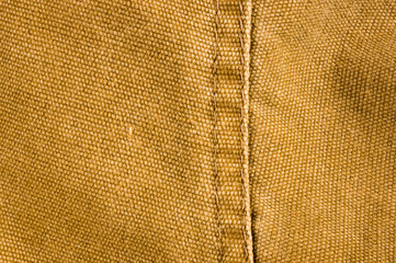 clothing items stonewashed cotton fabric texture with seams, clasps, buttons and rivets, macro