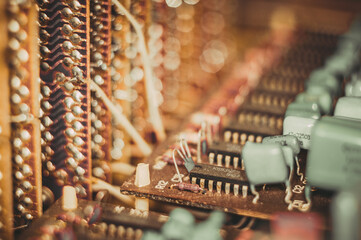 Vintage electronic circuit boards with radio parts and chips, close-up, macro photo