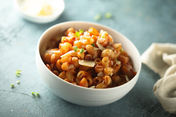 Traditional homemade pasta with tomato sauce and cheese