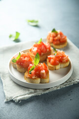 Traditional homemade bruschetta with tomato and basil