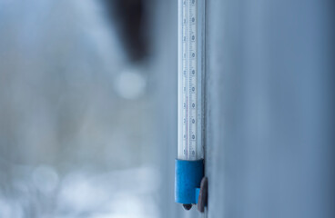 thermometer outdoor in the winter with freezing temperature