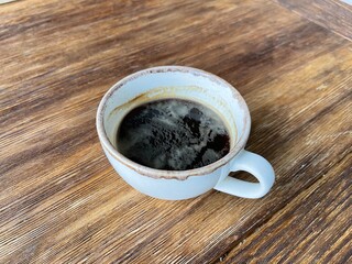 cup of coffee on wooden table