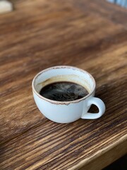 cup of coffee on wooden table