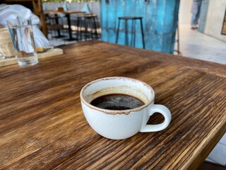 cup of coffee on wooden table