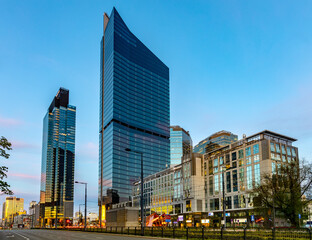 New business and financial district Wola with Warsaw Unit and  Skyliner tower skyscrapers at Prosta street and Daszynskiego circle in Warsaw, Poland - obrazy, fototapety, plakaty