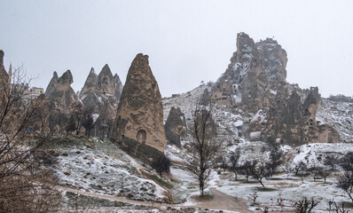 Snowy panorama view of fairy chimneys in winter the Paradise Valley in Cappadocia, Turkey