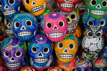Fototapeta na wymiar Colorful traditional Mexican pottery in a street market. Mexican souvenir - skull