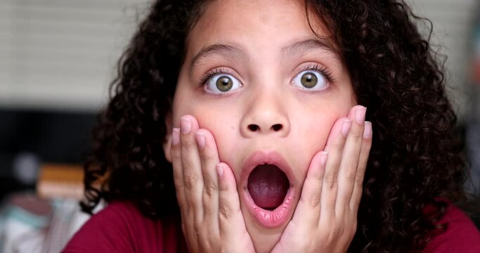 Preteen child shock surprise reaction. Girl amazement emotion