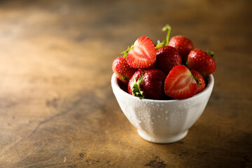 Fresh strawberry in a white bowl
