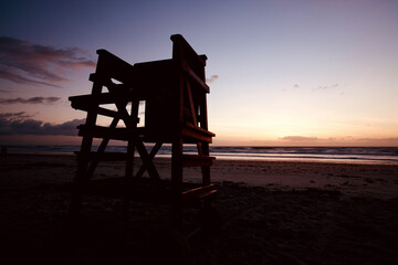 Fototapeta na wymiar lifeguard chair in Sunrise light