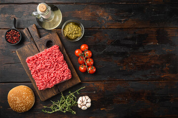 Raw meatballs burger or sandwich ingredients with sesame buns, on old dark  wooden table background, top view flat lay, with copy space for text
