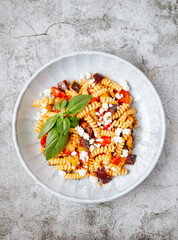 Pasta with aubergine, feta and tomato sauce