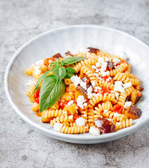 Pasta with aubergine, feta and tomato sauce