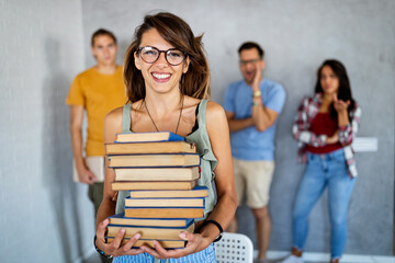 People, knowledge, education and school concept. Happy student girl with books