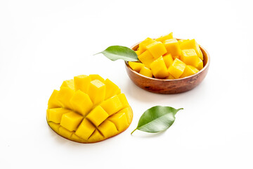 Tropical mango slices and cubes in wooden bowl