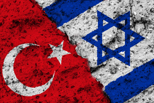 Concept of a Conflict between Israel and Turkey with painted flags on a wall with a crack