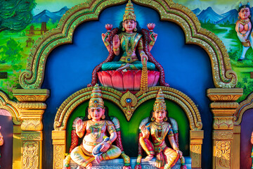Colourful statues of Hindu religious deities adorning the interior of a Hindu temple in Singapore.