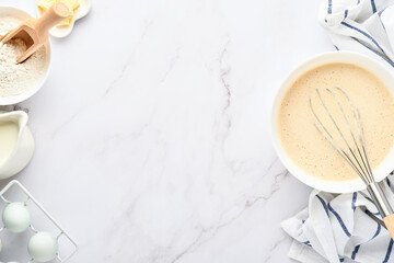 Preparation of dough for home pancakes for Breakfast or for Maslenitsa. Ingredients on the table - wheat flour, eggs, butter, sugar, salt, milk. Recipe step by step. Top view with place for text.