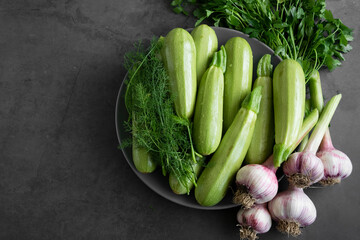 Fresh spring vegetables - zucchini, fresh garlic, wild fennel and parsley

