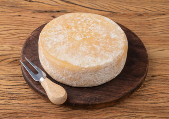 Artisanal Canastra cheese from Minas Gerais, Brazil over wooden board