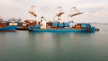 Container ship at industrial port in import export global business services logistic and transportation,