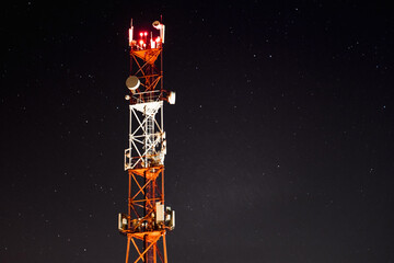 Against the background of the starry sky, the mobile communication towers of the 4g and 5g systems