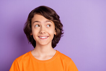 Portrait of attractive cheerful curious boy thinking copy empty space isolated over violet purple color background