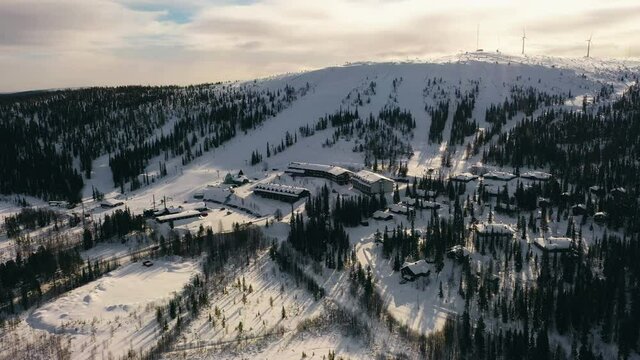 Aerial view of the Olostunturi ski center, in Lapland - descending, drone shot