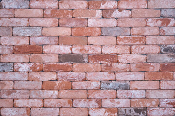 Old red brickwall, background. Wall of light and dark bricks of different shades, copy space for text