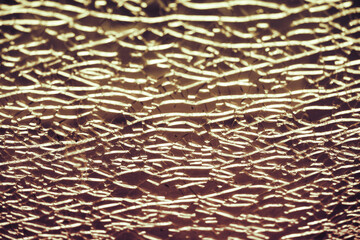 Brown background of cracks on broken glass, texture