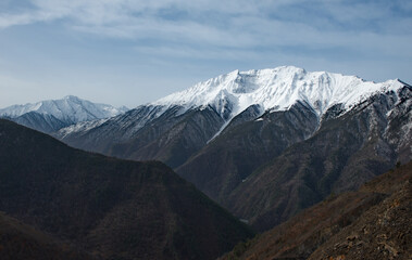 Fototapeta premium Russia. North-Eastern Caucasus, Republic of Dagestan. Snow peaks of mountain peaks near the village of Tlarata.