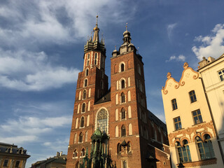 View of the St. Mary's Basilica, a Brick Gothic church adjacent to the Main Market Square in Kraków, Poland. It serves as one of the best examples of Polish Gothic architecture. 