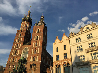 Fototapeta na wymiar View of the St. Mary's Basilica, a Brick Gothic church adjacent to the Main Market Square in Kraków, Poland. It serves as one of the best examples of Polish Gothic architecture. 