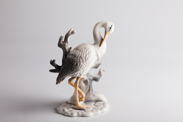 Vintage porcelain figurine of a bird isolated on white background